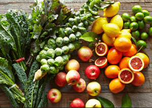 a group of fruits and vegetables on a wood surface Healthy Weight Loss Diets Whitley Sands