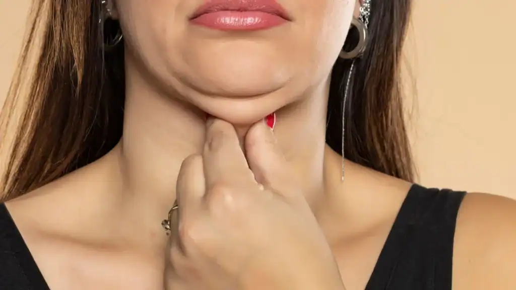 An image of a woman with double chin, sad, worried : Non Surgical Double Chin Removal Treatment in Whitley Sands, UK